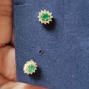 Emerald and gold earrings with diamond accents